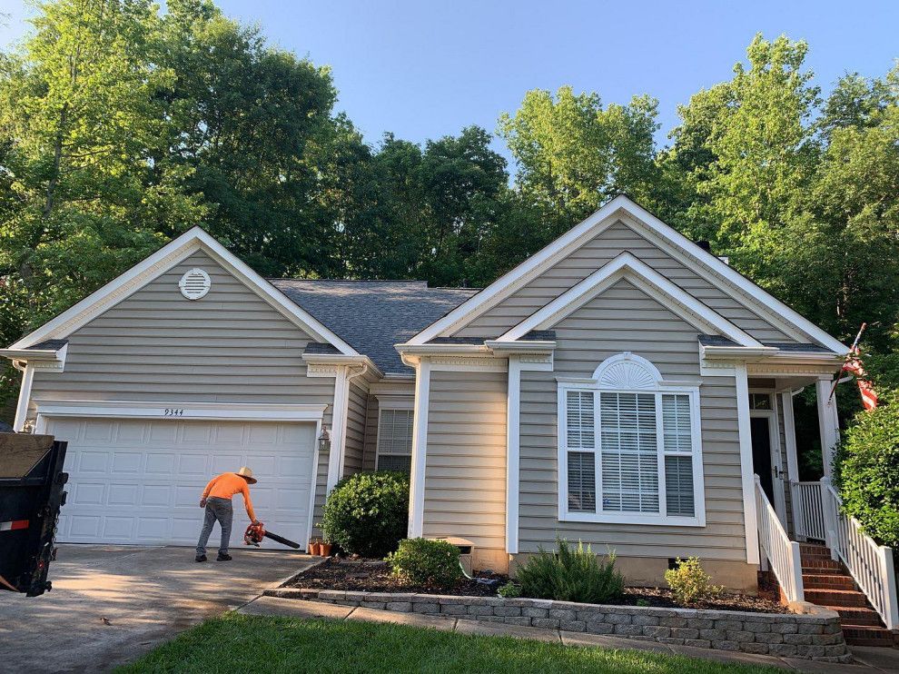 MCI Roofing crew working on an asphalt shingle roof