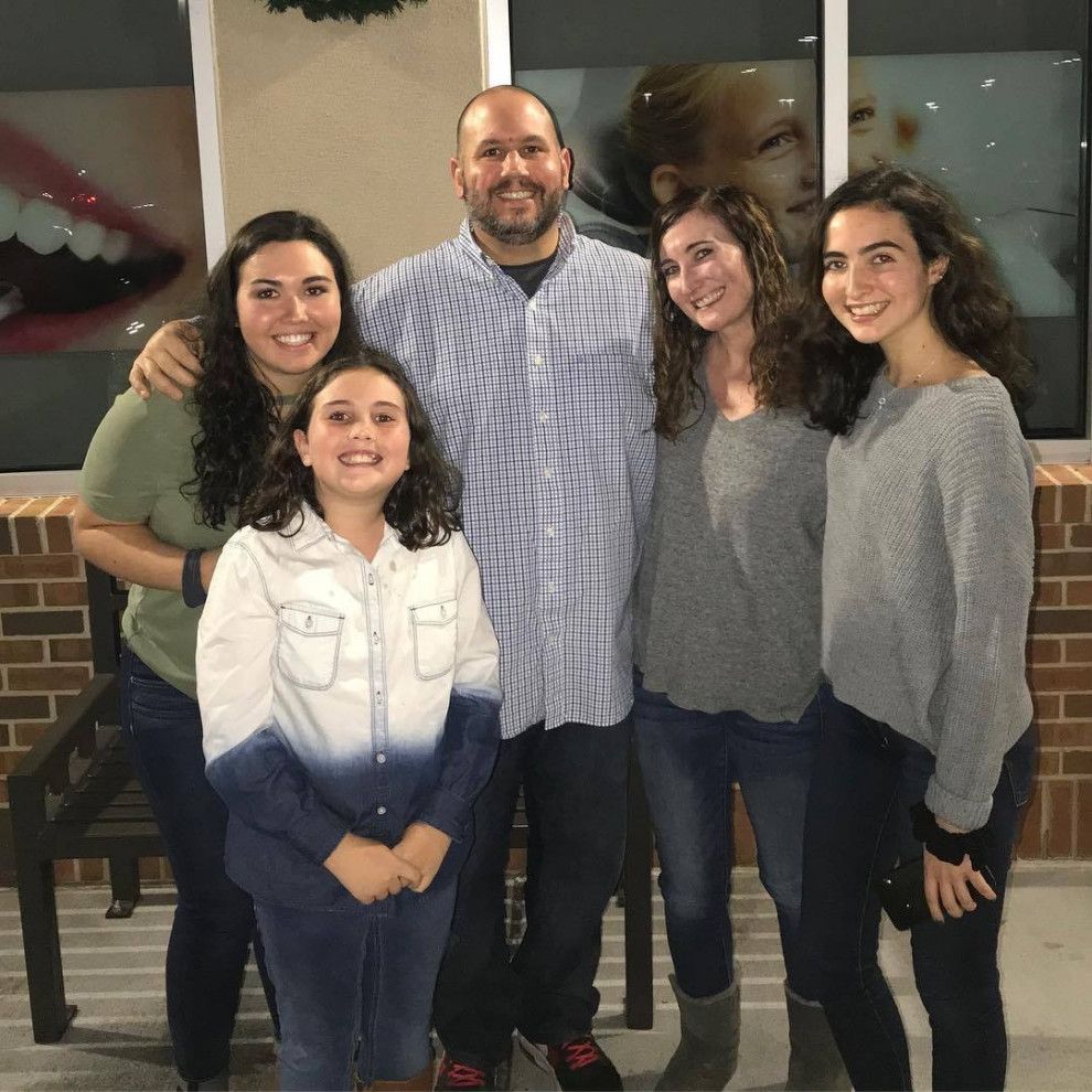 Mike Grodowsky, owner of MCI Roofing, with his family